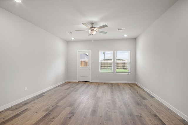 16899 Needlepoint Dr, Conroe, TX 77302 - unfurnished living room featuring a ceiling fan, wood finished floors, and recessed lighting