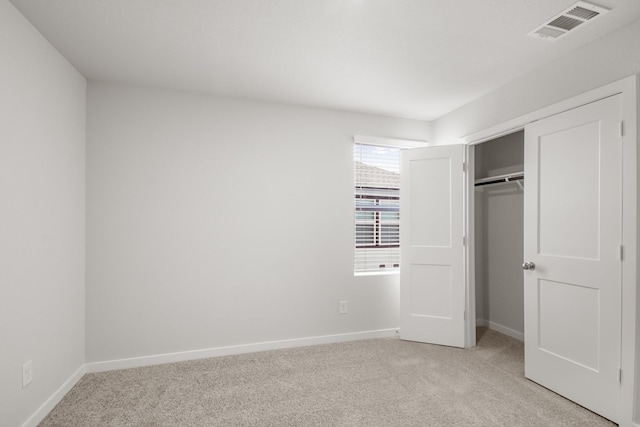 16899 Needlepoint Dr, Conroe, TX 77302 - unfurnished bedroom featuring light colored carpet and a closet