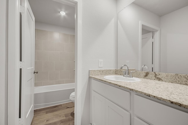 16899 Needlepoint Dr, Conroe, TX 77302 - bathroom with vanity, wood finished floors, and shower / tub combination