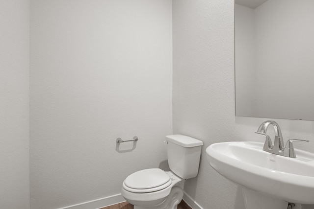16899 Needlepoint Dr, Conroe, TX 77302 - bathroom featuring a sink and wood finished floors