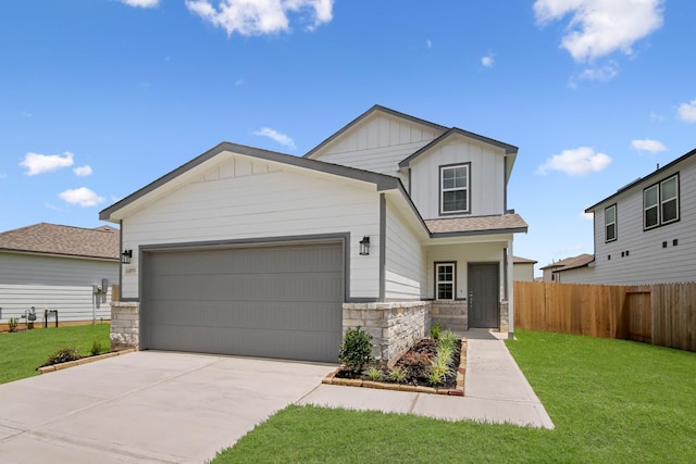16899 Needlepoint Dr, Conroe, TX 77302 - view of front of home featuring board and batten siding, stone siding, concrete driveway, and a garage