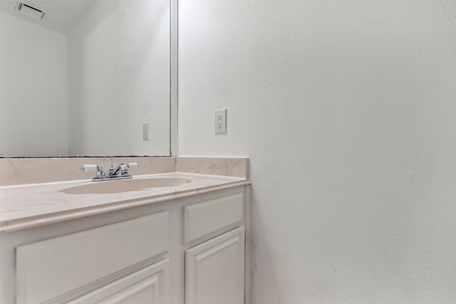 bathroom featuring visible vents and vanity