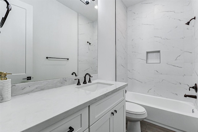 bathroom with toilet, vanity, and shower / tub combination