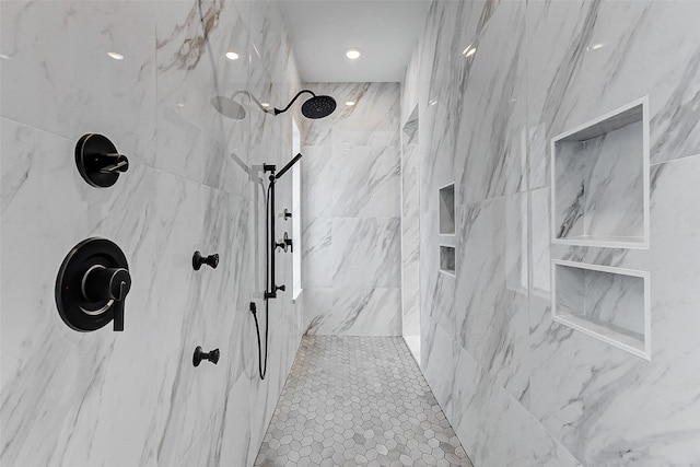 full bath with a marble finish shower