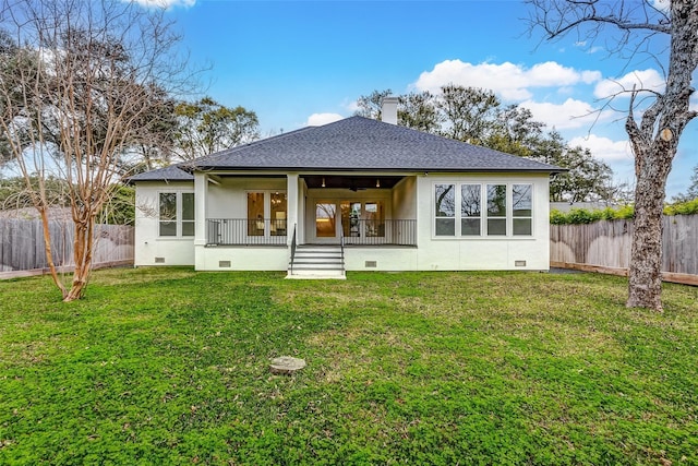 back of house with a lawn, crawl space, a shingled roof, and a fenced backyard