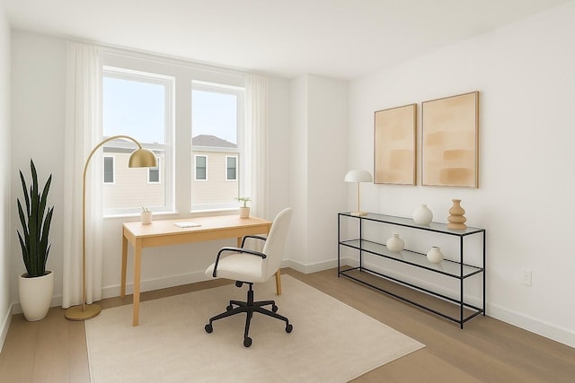 3826 Wilmer St, Houston, TX 77003 - home office featuring baseboards and wood finished floors
