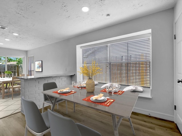 403 Elder Vista Dr, Houston, TX 77598 - dining area featuring recessed lighting, wood finished floors, a textured ceiling, and baseboards