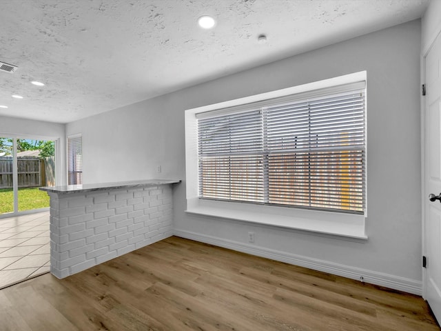 403 Elder Vista Dr, Houston, TX 77598 - unfurnished dining area with baseboards, wood finished floors, and recessed lighting