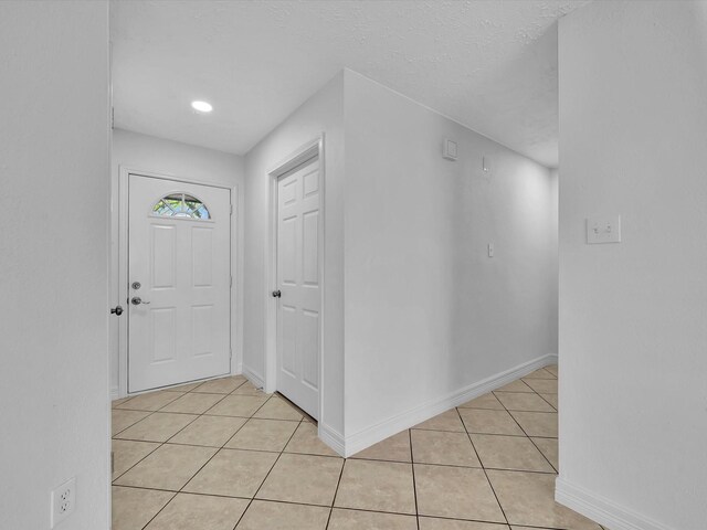 403 Elder Vista Dr, Houston, TX 77598 - entryway featuring baseboards and light tile patterned floors