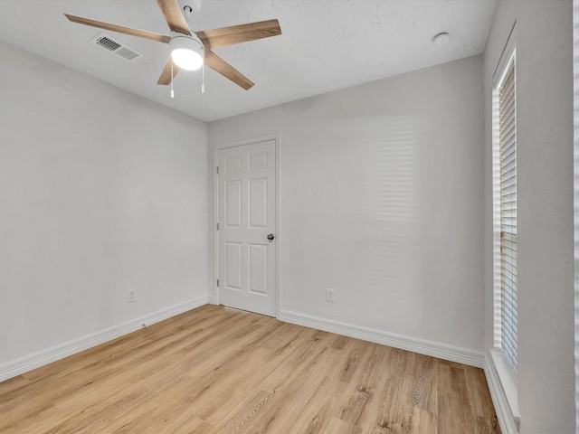 403 Elder Vista Dr, Houston, TX 77598 - empty room featuring visible vents, light wood finished floors, baseboards, and a ceiling fan