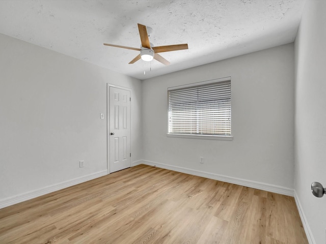 403 Elder Vista Dr, Houston, TX 77598 - unfurnished room featuring a ceiling fan, baseboards, and light wood-style floors