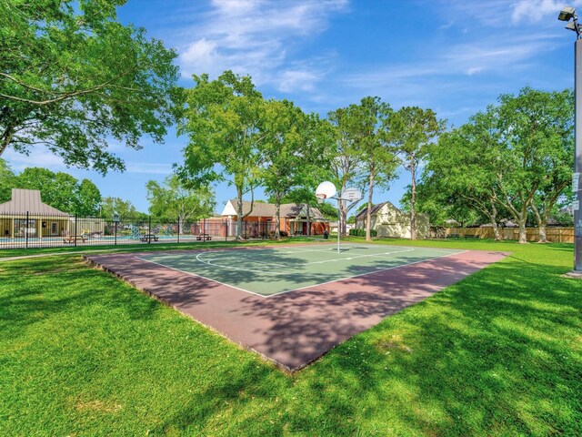 403 Elder Vista Dr, Houston, TX 77598 - view of basketball court featuring community basketball court, fence, and a lawn