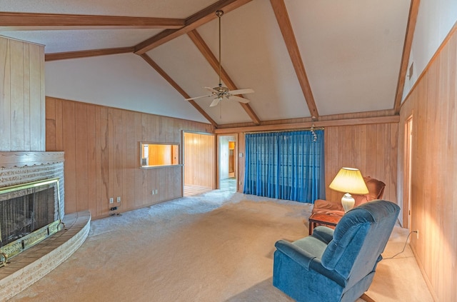 1345 10th St, Hempstead, TX 77445 - unfurnished living room with ceiling fan, beamed ceiling, wooden walls, and carpet