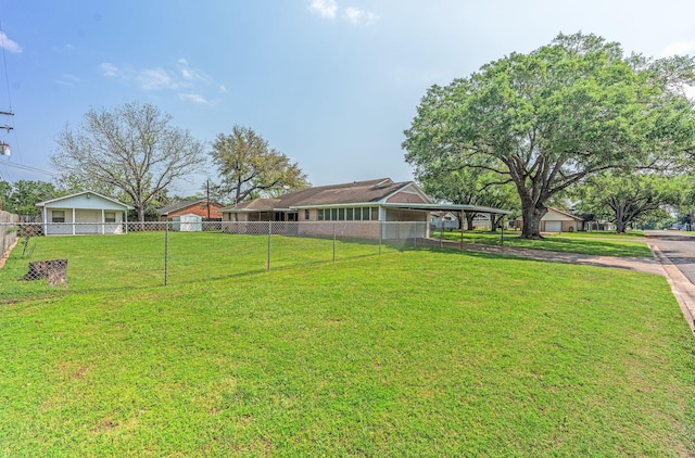 1345 10th St, Hempstead, TX 77445 - view of yard featuring fence and a carport