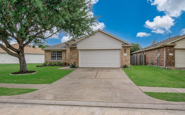 5823 Plantation Crest Dr, Katy, TX 77449 - single story home featuring concrete driveway, brick siding, a garage, and a front yard