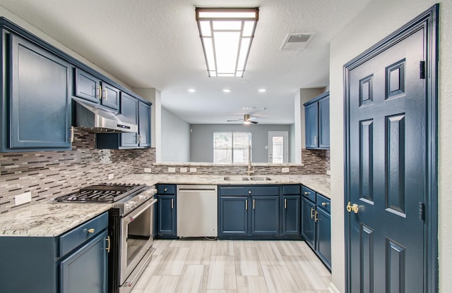 5823 Plantation Crest Dr, Katy, TX 77449 - kitchen with stainless steel appliances, visible vents, decorative backsplash, a ceiling fan, and under cabinet range hood