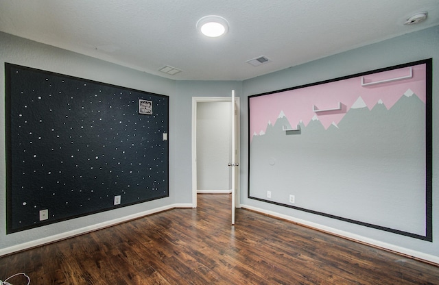 5823 Plantation Crest Dr, Katy, TX 77449 - spare room with baseboards, wood finished floors, and visible vents