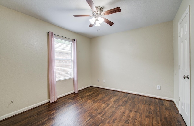 5823 Plantation Crest Dr, Katy, TX 77449 - spare room with a ceiling fan, baseboards, and dark wood-type flooring
