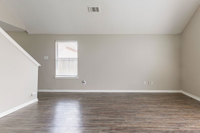 7850 Winding Creek Vw, Houston, TX 77072 - empty room with vaulted ceiling, visible vents, baseboards, and wood finished floors