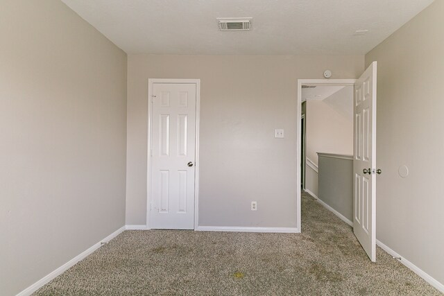 7850 Winding Creek Vw, Houston, TX 77072 - unfurnished bedroom featuring baseboards, carpet flooring, and visible vents