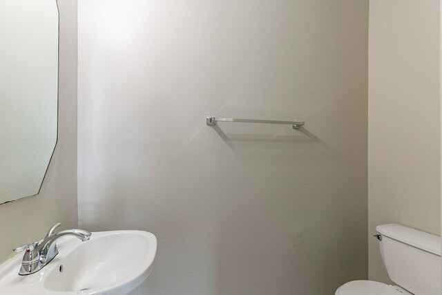bathroom with a sink and toilet