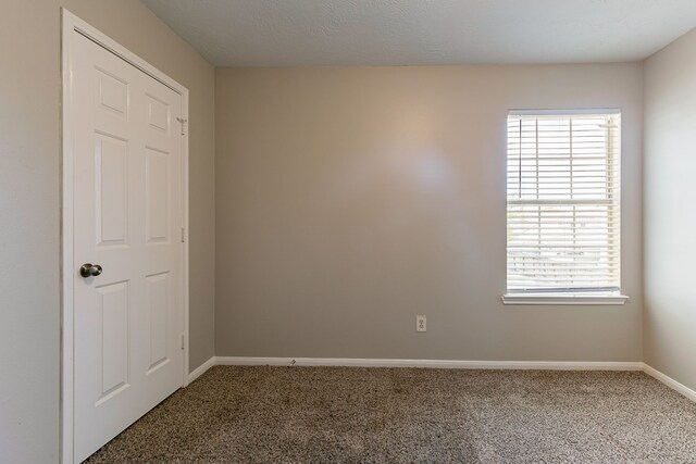 7850 Winding Creek Vw, Houston, TX 77072 - unfurnished room with plenty of natural light, baseboards, and carpet floors