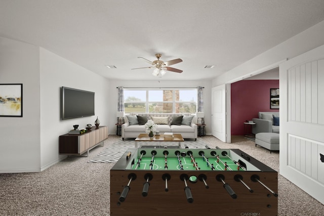 playroom with ceiling fan, baseboards, visible vents, and light colored carpet