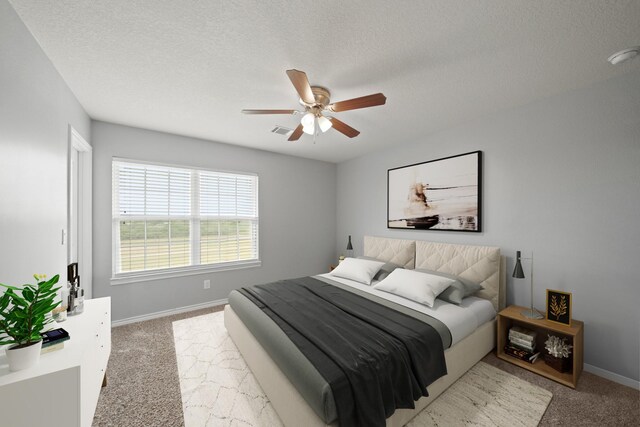 carpeted bedroom with a textured ceiling, visible vents, baseboards, and ceiling fan