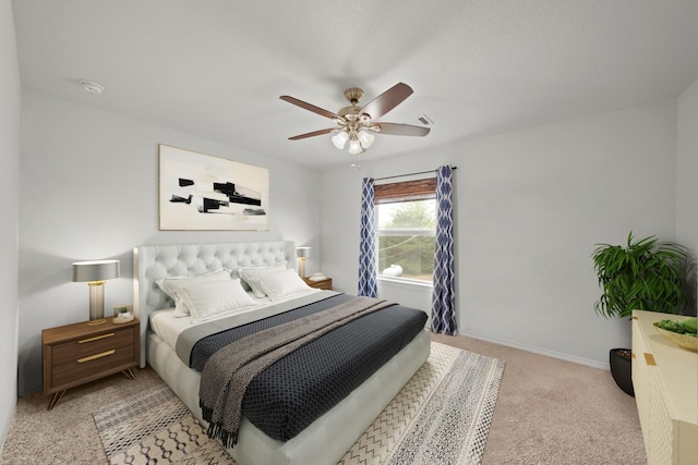 bedroom with light carpet, baseboards, and ceiling fan