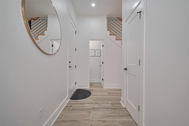 doorway to outside with stairway, recessed lighting, and light wood-style flooring