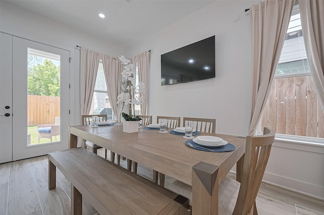 dining space with light wood-type flooring