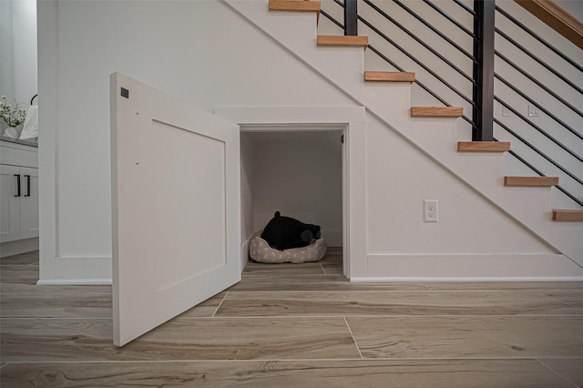 staircase with wood finished floors