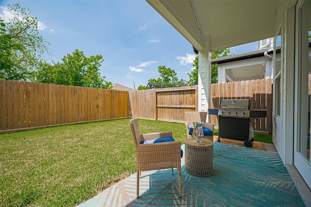 view of yard with a fenced backyard and a patio area