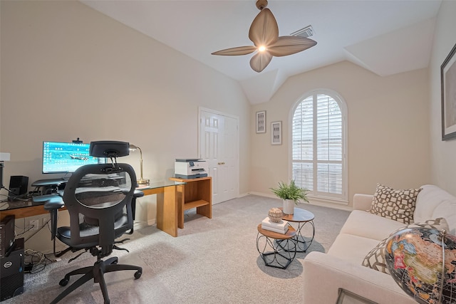 carpeted office space featuring baseboards, visible vents, ceiling fan, and vaulted ceiling
