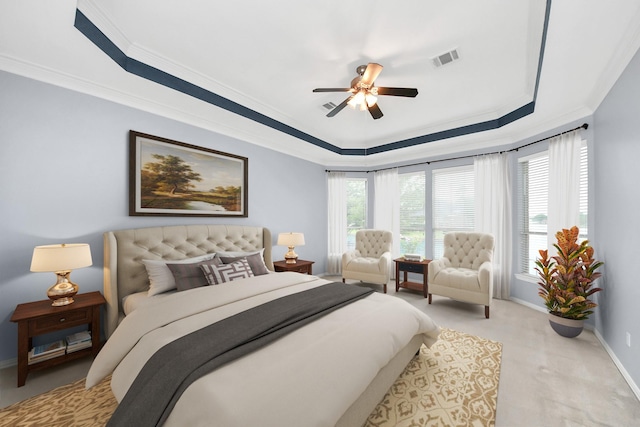 carpeted bedroom with a raised ceiling, visible vents, a ceiling fan, ornamental molding, and baseboards