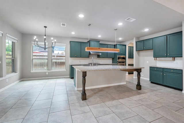 kitchen with light tile patterned flooring, visible vents, and decorative backsplash