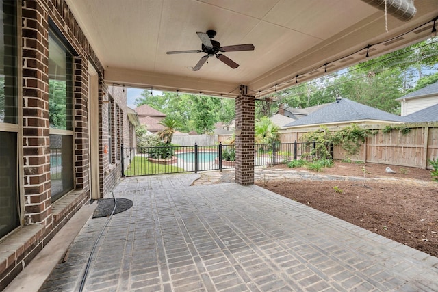 view of patio with a fenced backyard and ceiling fan