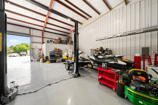 garage with electric panel and metal wall