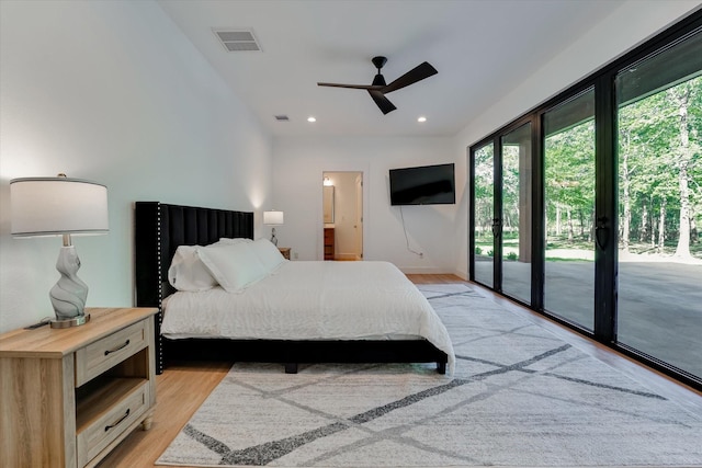 11571 Robin Ln, Conroe, TX 77303 - bedroom featuring multiple windows, light wood-type flooring, visible vents, and access to exterior