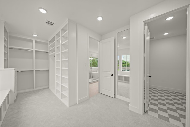 interior space with visible vents and light carpet