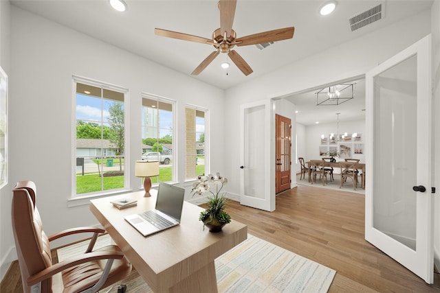 office featuring light wood-style floors, baseboards, recessed lighting, and visible vents