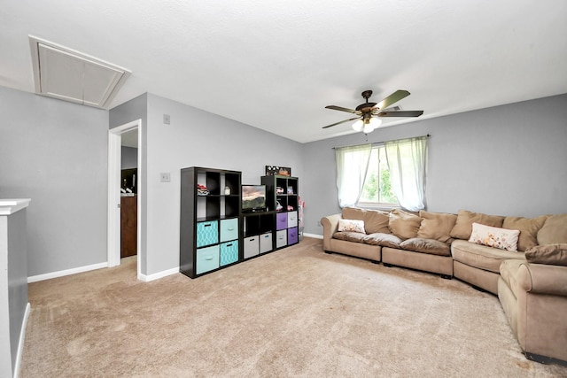 living room with attic access, baseboards, carpet, lofted ceiling, and ceiling fan