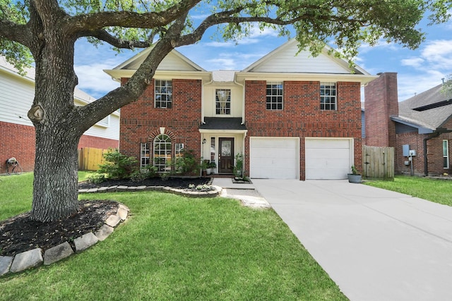traditional-style house with driveway, fence, brick siding, an attached garage, and a front yard
