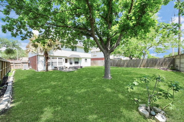 view of yard with a fenced backyard