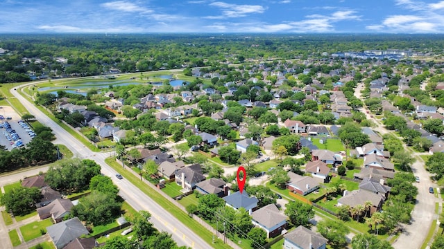 drone / aerial view with a residential view and a water view