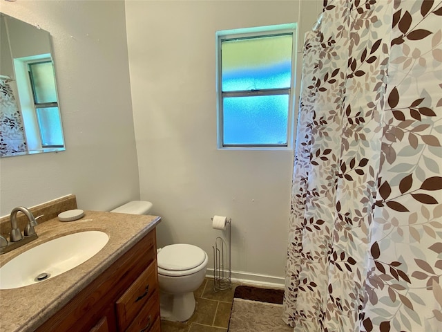full bath with a shower with shower curtain, toilet, vanity, and tile patterned floors