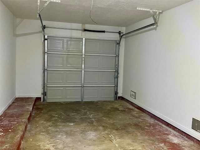 garage featuring baseboards