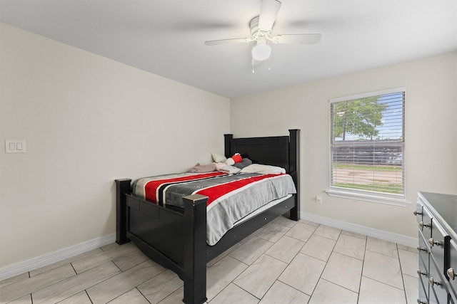 bedroom with baseboards and ceiling fan