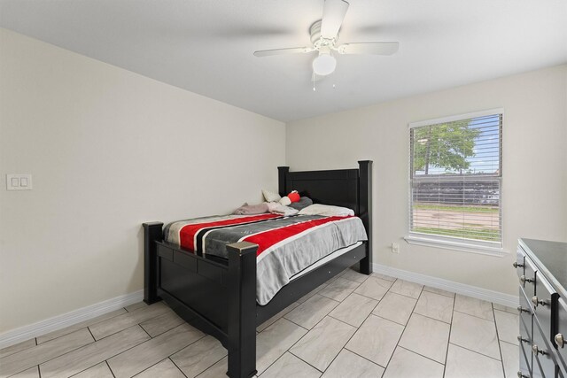 12901 Flagstaff Ln, Houston, TX 77049 - bedroom with baseboards and a ceiling fan
