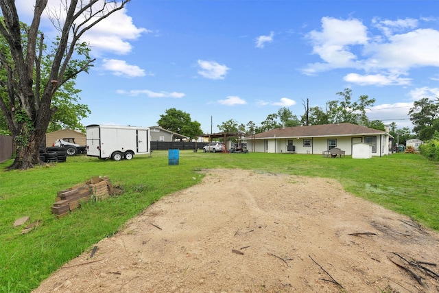 back of house with a lawn